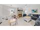 Cozy living room with a fireplace, comfortable seating, a ceiling fan, and playful ' decor at 4900 Skidmore St, Raleigh, NC 27609