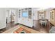 Bright living room featuring built-in shelving, hardwood floors, neutral furniture, and stylish decor at 4900 Skidmore St, Raleigh, NC 27609