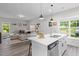 Open-concept living room and kitchen with modern island, stainless steel appliances, and stylish decor at 501 E Granville St, Dunn, NC 28334