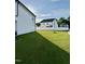 Expansive backyard featuring a verdant lawn and secure fencing, perfect for outdoor relaxation at 5117 Farm Barn Ln, Raleigh, NC 27603