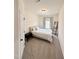 Bedroom with a bed, side table, ladder, carpet and a door at 5117 Farm Barn Ln, Raleigh, NC 27603