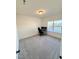 Bedroom featuring neutral carpet, a large window, and a desk with two monitors at 5117 Farm Barn Ln, Raleigh, NC 27603