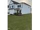 Charming two-story home with a well-manicured lawn and black trim at 5117 Farm Barn Ln, Raleigh, NC 27603