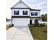 Charming two-story home with a spacious two-car garage and well-maintained lawn at 5117 Farm Barn Ln, Raleigh, NC 27603