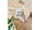 Bright foyer with hardwood floors, chandelier, staircase, and neutral decor at 5117 Farm Barn Ln, Raleigh, NC 27603