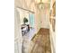 Welcoming hallway with natural light leading to a dining room with French doors at 5117 Farm Barn Ln, Raleigh, NC 27603