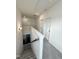 Upstairs hallway boasts neutral carpet and paint, leading to bedrooms and attic access at 5117 Farm Barn Ln, Raleigh, NC 27603