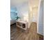 Hallway with luxury vinyl plank flooring, console table, and access to multiple rooms at 5117 Farm Barn Ln, Raleigh, NC 27603