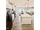 Modern kitchen with stainless steel appliances, island, and an open layout at 5117 Farm Barn Ln, Raleigh, NC 27603