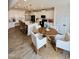 Open concept kitchen with a large island, stainless steel appliances, and adjacent dining area at 5117 Farm Barn Ln, Raleigh, NC 27603