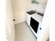 Efficient laundry room features a modern washer and dryer set with convenient shelving above at 5117 Farm Barn Ln, Raleigh, NC 27603