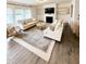 Inviting living room with a fireplace, built-in shelves, and neutral color palette at 5117 Farm Barn Ln, Raleigh, NC 27603