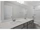 Modern bathroom features double sink vanity, quartz countertop and a shower at 55 Cordoba Dr, Franklinton, NC 27525
