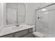Modern bathroom features white quartz countertop and glass-enclosed shower at 55 Cordoba Dr, Franklinton, NC 27525