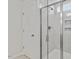 Ensuite bathroom showcasing tiled shower with glass door and shower head at 55 Cordoba Dr, Franklinton, NC 27525