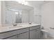 Bathroom features a double sink vanity with modern fixtures and a large mirror at 55 Cordoba Dr, Franklinton, NC 27525