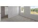 Light-filled bedroom with neutral carpet and two windows at 55 Cordoba Dr, Franklinton, NC 27525