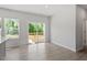 Dining area with sliding doors to the outdoor deck and light wood-look floors at 55 Cordoba Dr, Franklinton, NC 27525