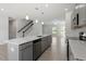 Open concept kitchen with a large island, stainless steel appliances, and easy access to the living areas at 55 Cordoba Dr, Franklinton, NC 27525