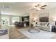 Open-concept living room and kitchen with hardwood floors and modern decor at 55 Cordoba Dr, Franklinton, NC 27525