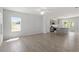 Spacious living room with light-colored floors and ample natural light, open to the kitchen at 55 Cordoba Dr, Franklinton, NC 27525