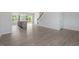 Open concept living area with light floors and a seamless transition to the kitchen and outdoor spaces at 55 Cordoba Dr, Franklinton, NC 27525