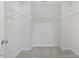 Spacious walk-in closet with ample shelving and carpeting at 55 Cordoba Dr, Franklinton, NC 27525