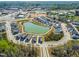 Aerial view of a planned community featuring a central pond, winding roads, and modern homes at 5800 Agrinio Way, Raleigh, NC 27603