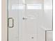 Modern bathroom with walk-in glass shower featuring a built-in seat at 5800 Agrinio Way, Raleigh, NC 27603