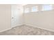 Neutral bedroom featuring a large window and a closet with neutral walls and carpeting at 5800 Agrinio Way, Raleigh, NC 27603