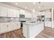 Bright kitchen with stainless steel appliances, granite countertops, and a spacious island at 5800 Agrinio Way, Raleigh, NC 27603