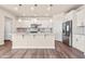 Modern kitchen with stainless steel appliances, white cabinets, and granite countertops at 5800 Agrinio Way, Raleigh, NC 27603