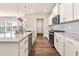 Modern kitchen with granite countertops, stainless steel appliances, and ample cabinet space at 5800 Agrinio Way, Raleigh, NC 27603