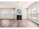 Spacious living room features a fireplace, recessed lighting, and hardwood floors at 5800 Agrinio Way, Raleigh, NC 27603