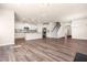 Expansive open-concept living space with hardwood floors, a modern kitchen, and plenty of natural light at 5800 Agrinio Way, Raleigh, NC 27603