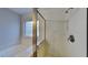 Bathroom featuring shower with glass door and view of soaking tub at 613 Ashburn Ln, Durham, NC 27703