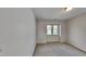 Bedroom with carpet flooring and natural light from the window at 613 Ashburn Ln, Durham, NC 27703