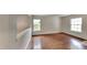 Bright bedroom with hardwood floors, white trim, and lots of natural light at 613 Ashburn Ln, Durham, NC 27703