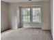 Bright bedroom with carpet and twin windows at 613 Ashburn Ln, Durham, NC 27703
