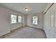 Bedroom with carpet and windows providing lots of natural light at 613 Ashburn Ln, Durham, NC 27703