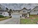 Charming two-story home with attached garage and beautiful landscaping at 613 Ashburn Ln, Durham, NC 27703