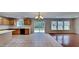 Spacious kitchen with tile floors, cabinets, black appliances, and lots of natural light at 613 Ashburn Ln, Durham, NC 27703