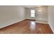 Bright living room with hardwood floors, neutral walls, and lots of natural light at 613 Ashburn Ln, Durham, NC 27703