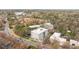 Scenic aerial view of community surrounded by lush trees with city buildings in the distance at 620 Wade Ave # 506, Raleigh, NC 27605
