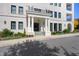 A welcoming building entrance with grand columns, detailed landscaping, and a covered entry at 620 Wade Ave # 506, Raleigh, NC 27605