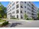 Exterior view of building with nicely manicured landscaping at 620 Wade Ave # 506, Raleigh, NC 27605