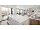 Spacious kitchen with large island and quartz countertops opens up to dining and living room at 620 Wade Ave # 506, Raleigh, NC 27605