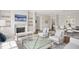Bright living room with modern decor, fireplace, built-in shelving, and an open concept to the dining area at 620 Wade Ave # 506, Raleigh, NC 27605