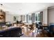 Community lounge featuring couches and chairs, multiple seating areas, and large windows at 620 Wade Ave # 506, Raleigh, NC 27605