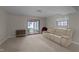 Finished basement with sliding glass door leading to patio at 6216 Lewisand Cir, Raleigh, NC 27615